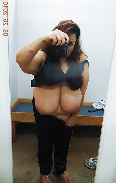 Many selfies of huge boobed mature