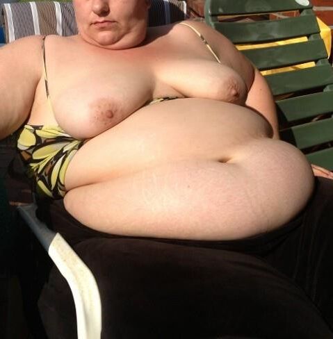 Fat KG german MILF flashes anging tits and belly in the sun