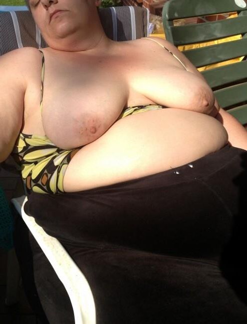 Fat KG german MILF flashes anging tits and belly in the sun