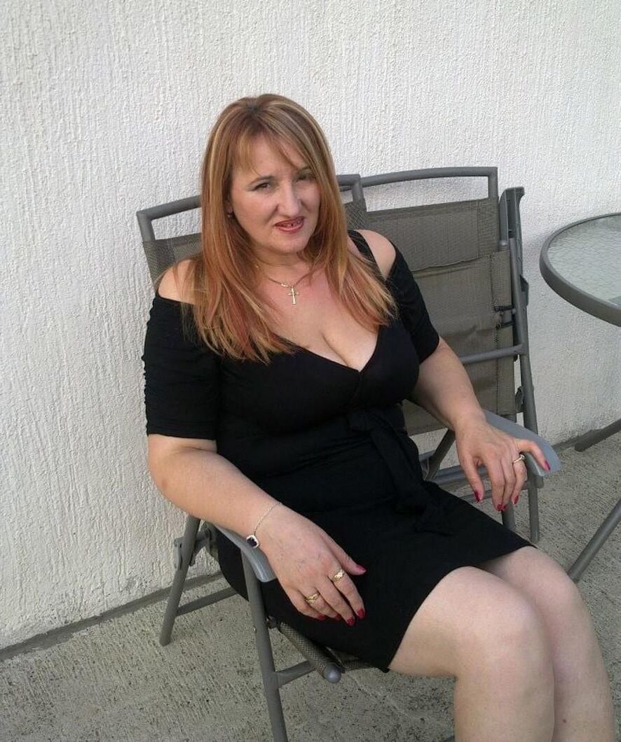 . Women fully dressed. No nudity