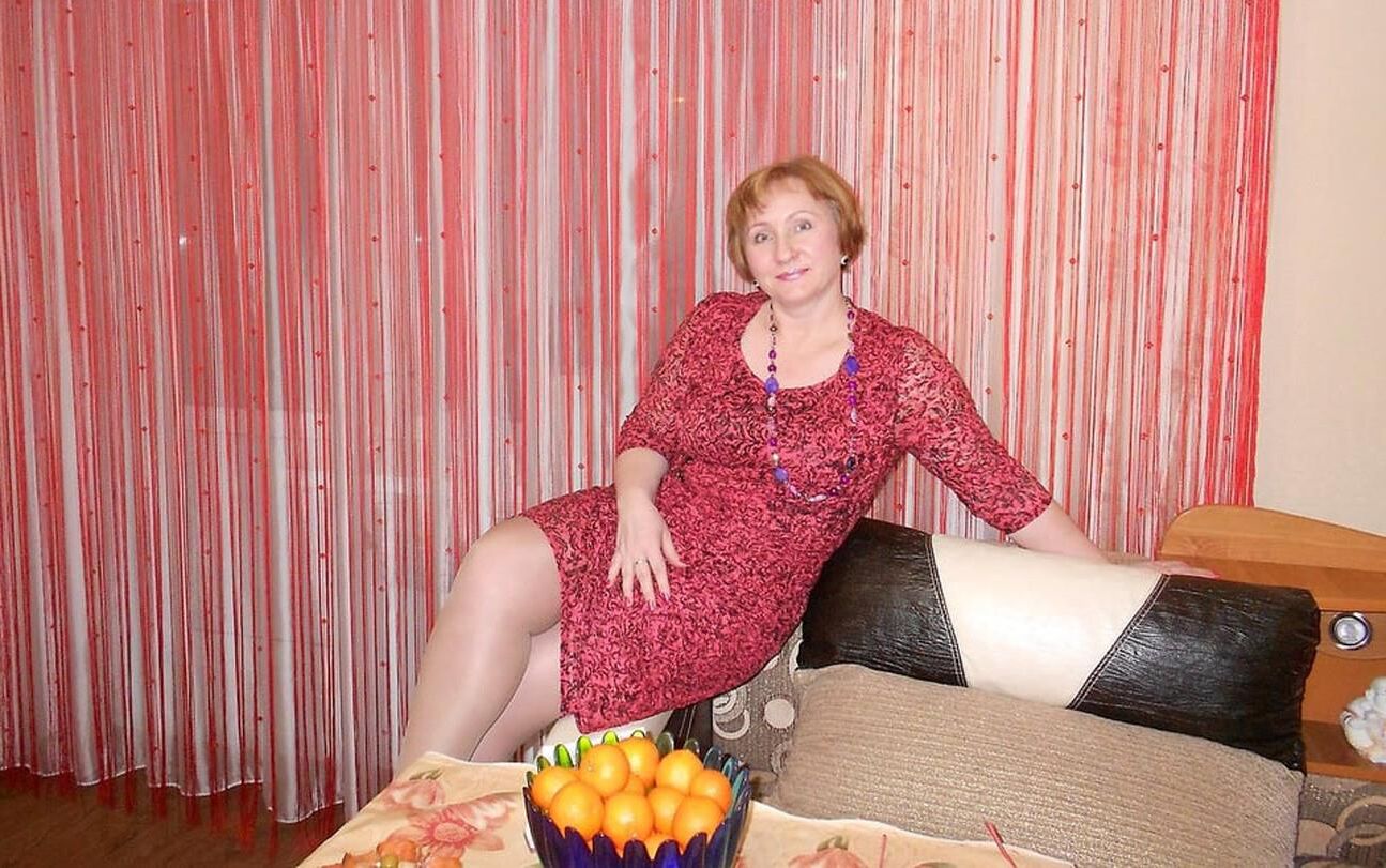 . Women fully dressed. No nudity