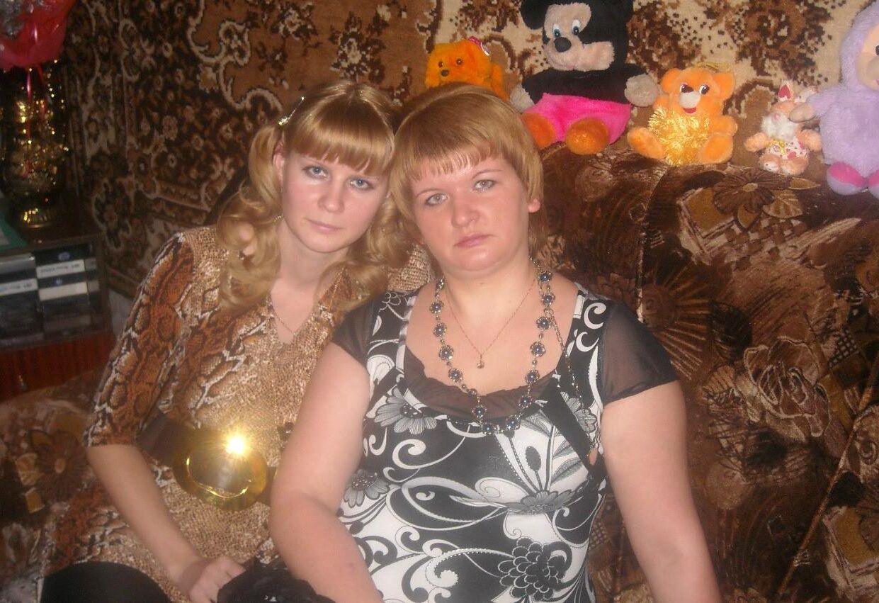 . Women fully dressed. No nudity