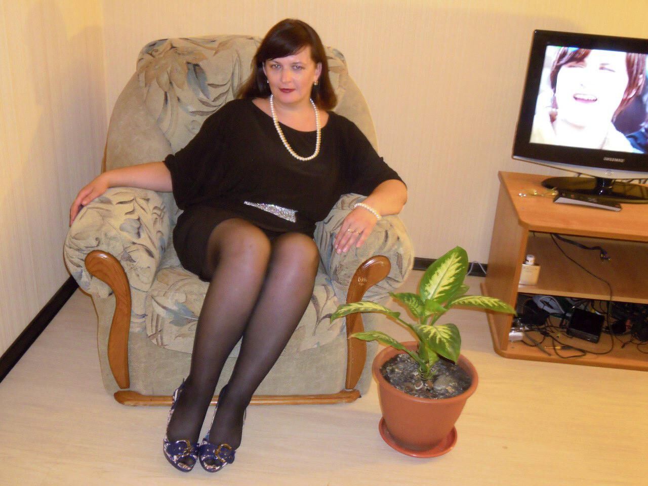 . Women fully dressed, no nudity